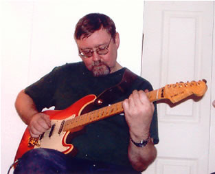 Ian Fairbairn playing electric guitar